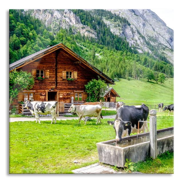 Cows In Front Of A Log Cabin On Alpine Pasture - No Frame Print on Glass August Grove Size: 70cm H x 70cm W x 0.4cm D on Productcaster.