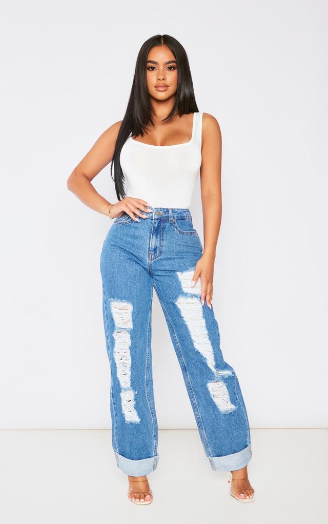 Petite Mid Blue Wash Distress Side Rip Wide Leg Jeans on Productcaster.