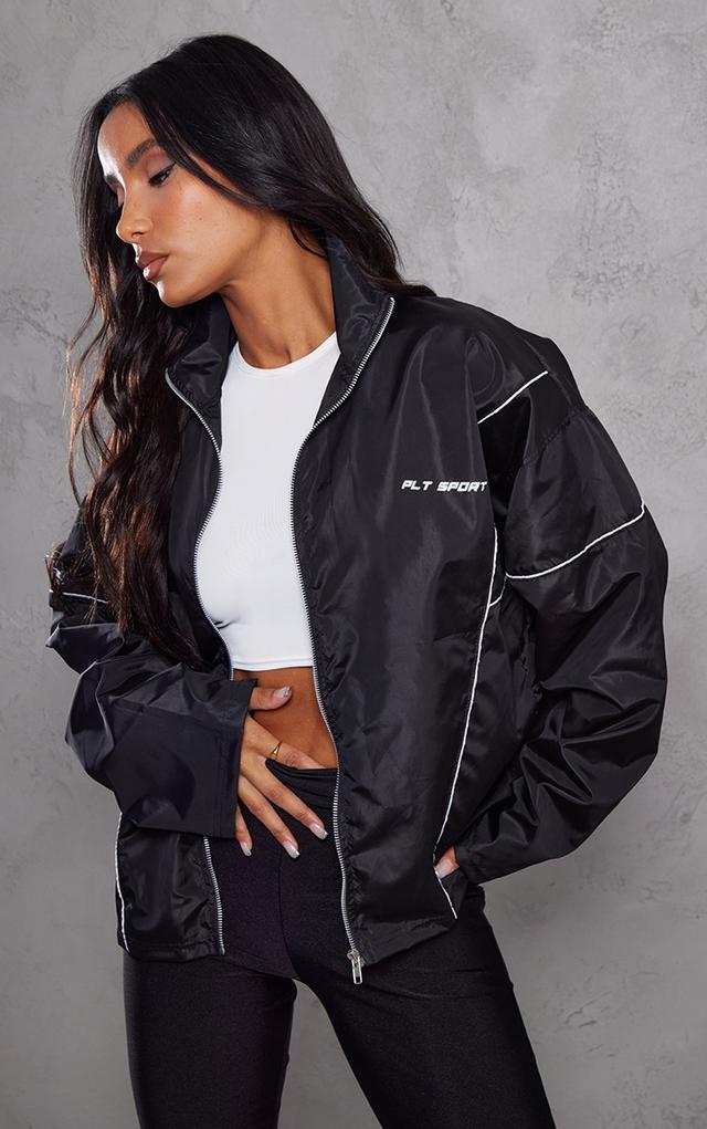 PRETTYLITTLETHING Black Sport Printed Seam Detail Shell Windbreaker on Productcaster.