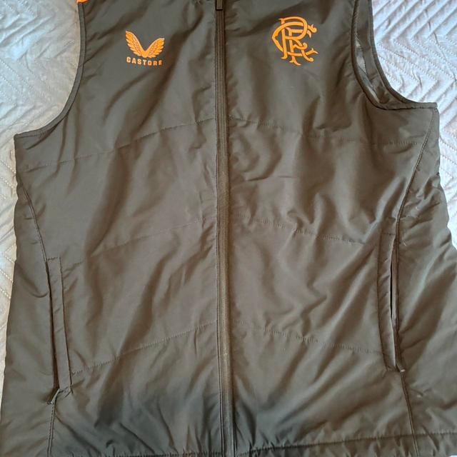 Castore Men's Gilet - Black/Orange - M on Productcaster.