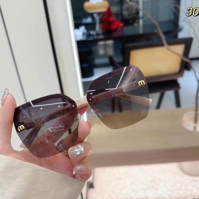 Miu Miu Women's Sunglasses - Brown/Black on Productcaster.