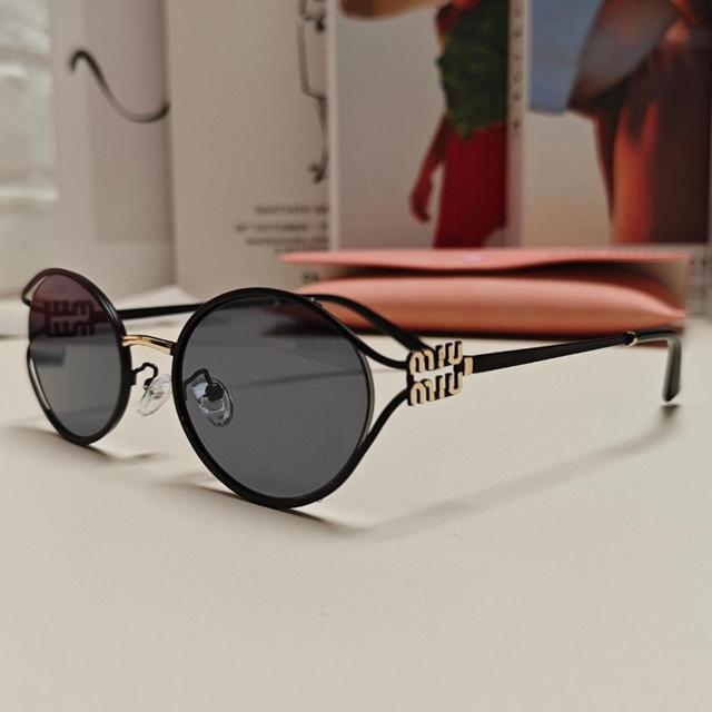 Miu Miu Women's Sunglasses - Black/Brown on Productcaster.