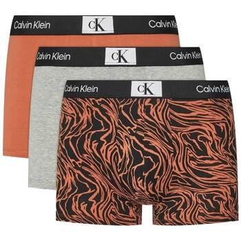 Boxers Calvin Klein Jeans 3 Pack Trunks Grey/Orange/Print on Productcaster.