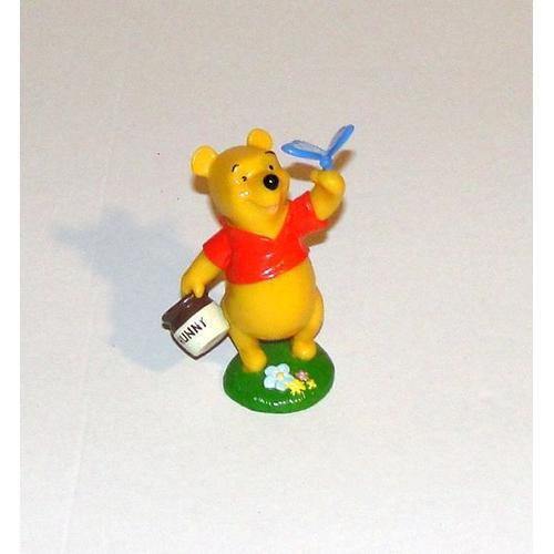 Figurine Disney Winnie L'ourson Avec Pot De Miel Et Papillon on Productcaster.