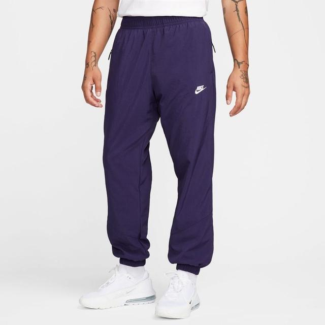 Nike Sweatpants Windrunner Woven - Purple/white, size Large on Productcaster.