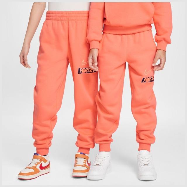 Nike Sweatpants Club Fleece Erling Haaland Personal Edition - Wild Mango/orange Pulse Kids, size L: 147-158 cm on Productcaster.