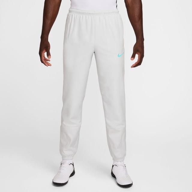 Nike Track Pants Academy + Repel Woven - Photon Dust/Dynamic Turq, size Large on Productcaster.